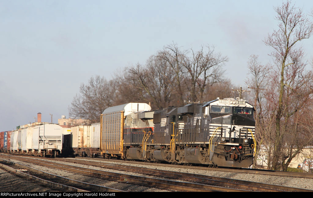 NS 8115 leads train 214 towards the signals at Aycock